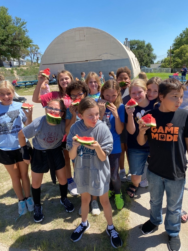 Sixth grade students enjoying watermelon during recess. The watermelon feed was sponsored by BW Telecom. 