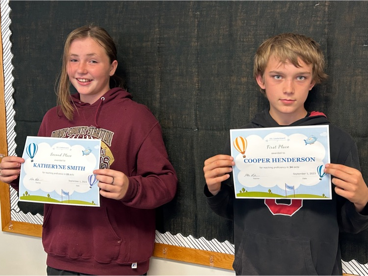 2 students show their awards